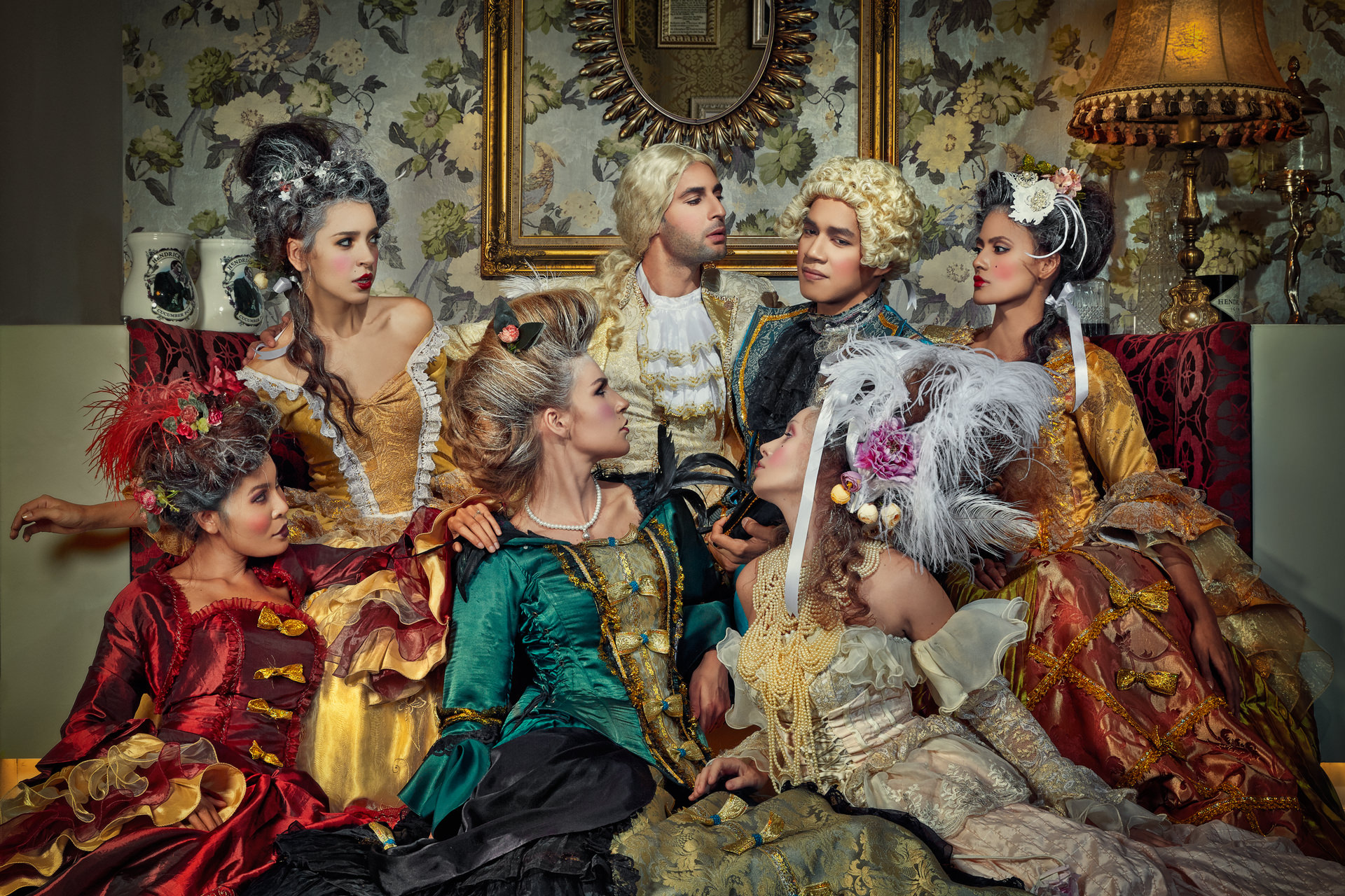 Greed, night. Eight cast in one frame, built as a composite from separate exposures.