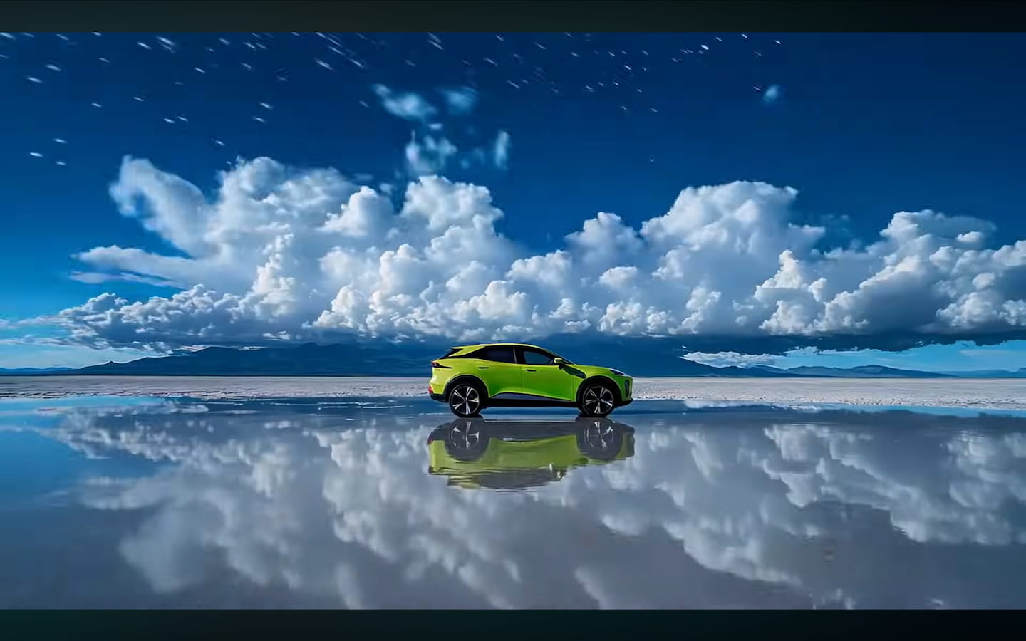 The Deepal S07 on the salt flat, sky and stars mirrored in still water